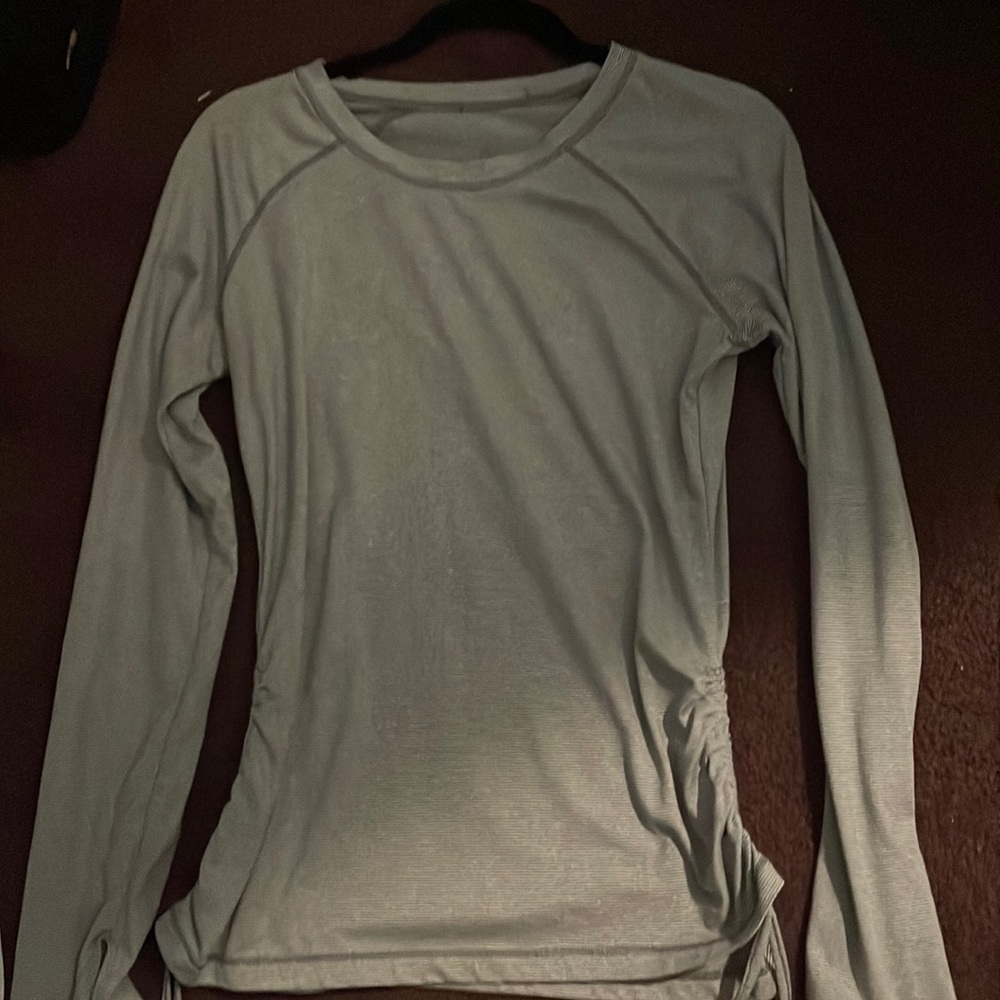 Gray long sleeve athletic shirt with ties on both side